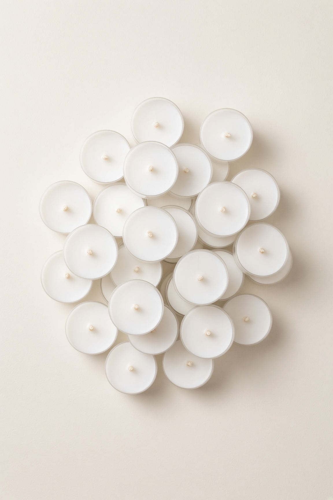 Overhead view of bulk white tealight candles